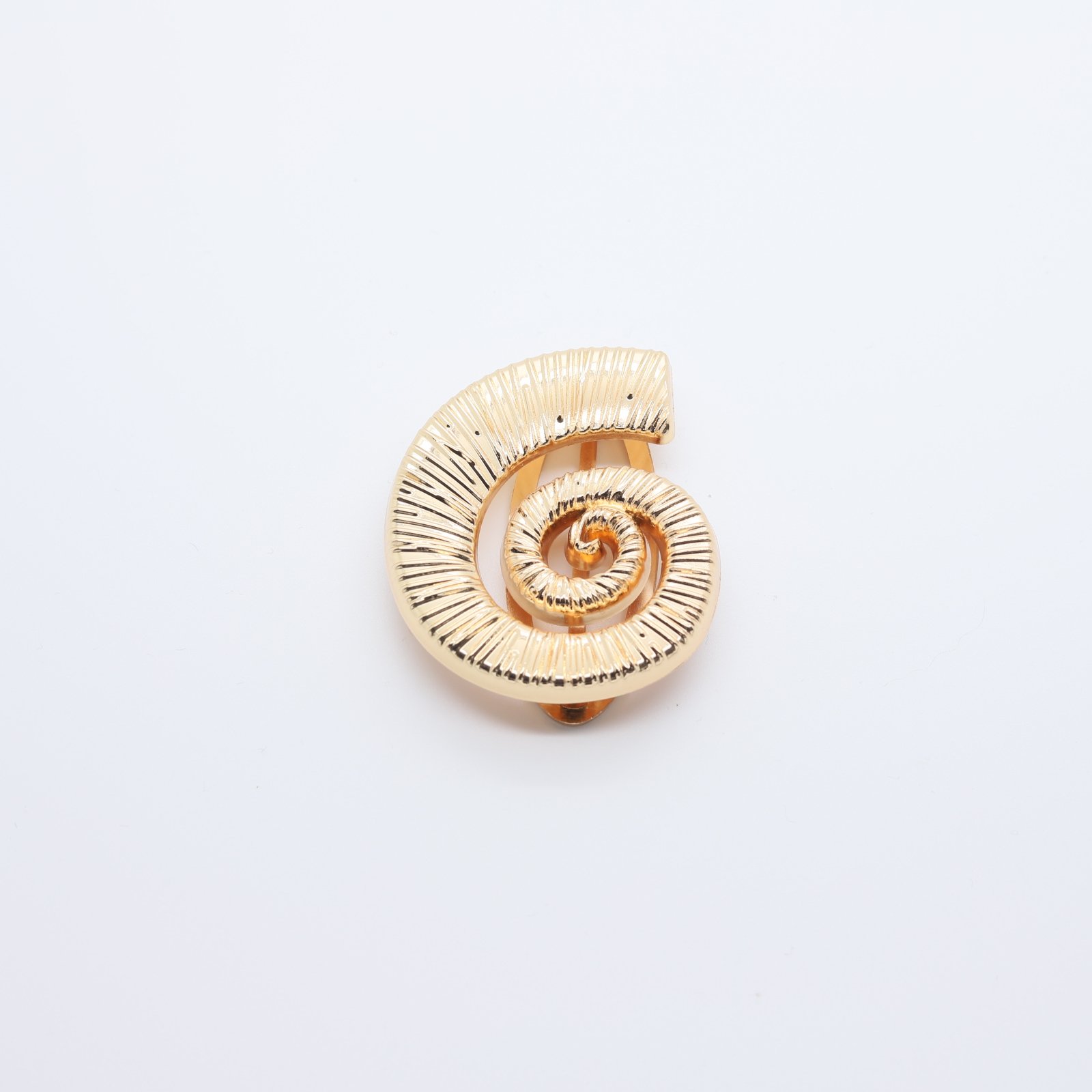 Passant en forme de coquille de conque