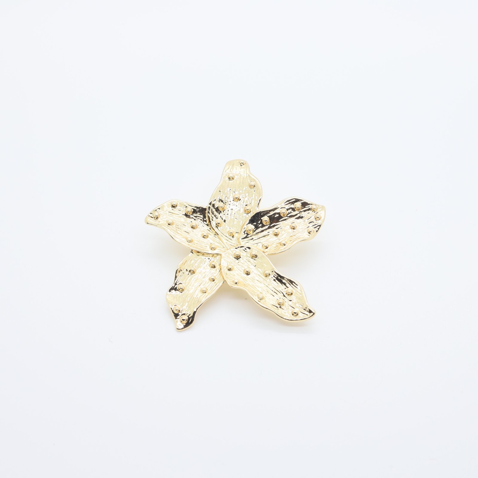 Broche décorative fleur dorée