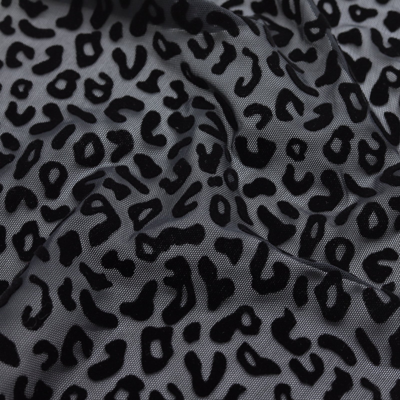 Résille extensible noire avec flocage léopard velours