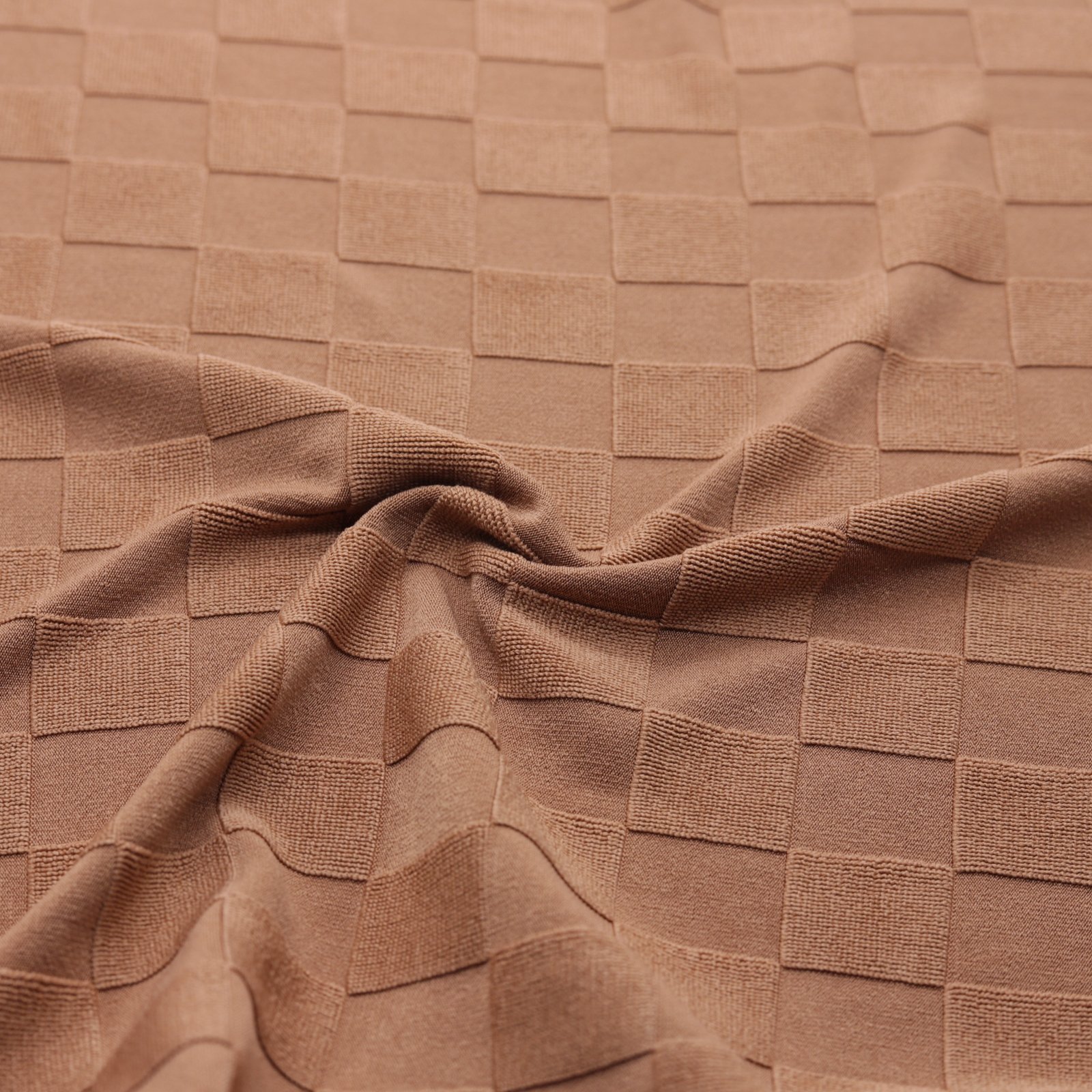 Tissu jacquard uni brun et texturé à petits carreaux