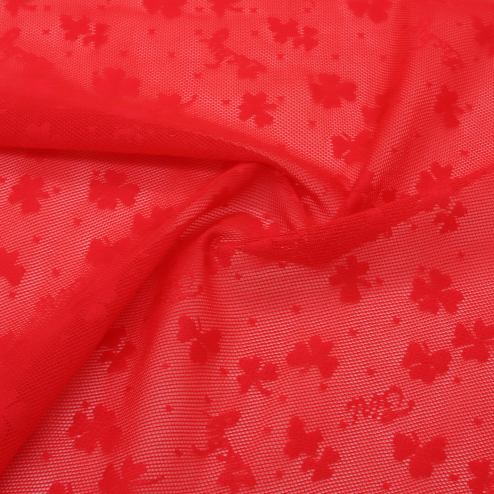 Tissu résille jacquard rouge motifs Lucky nylon élasthanne
