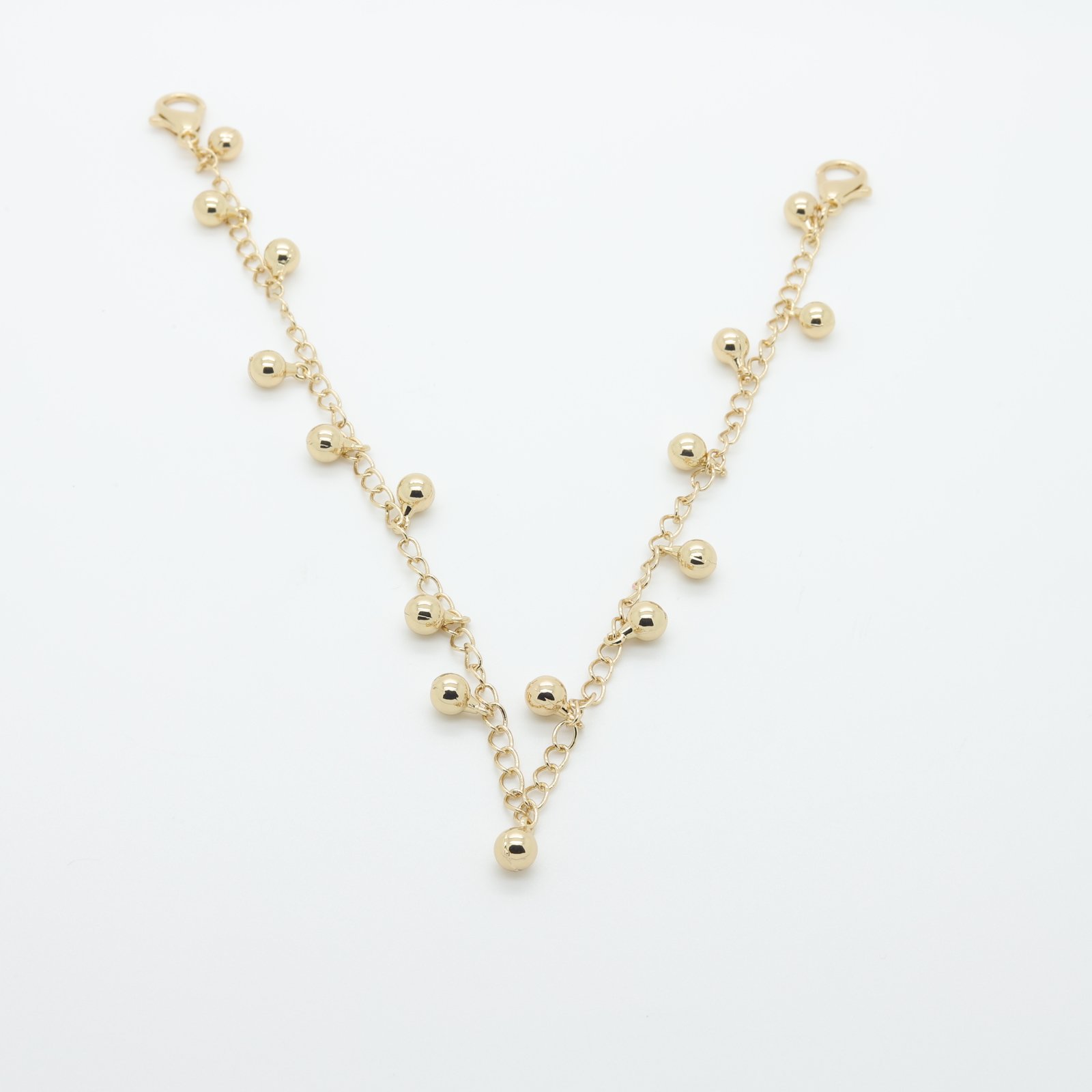 Chaîne décorative en métal doré à breloques