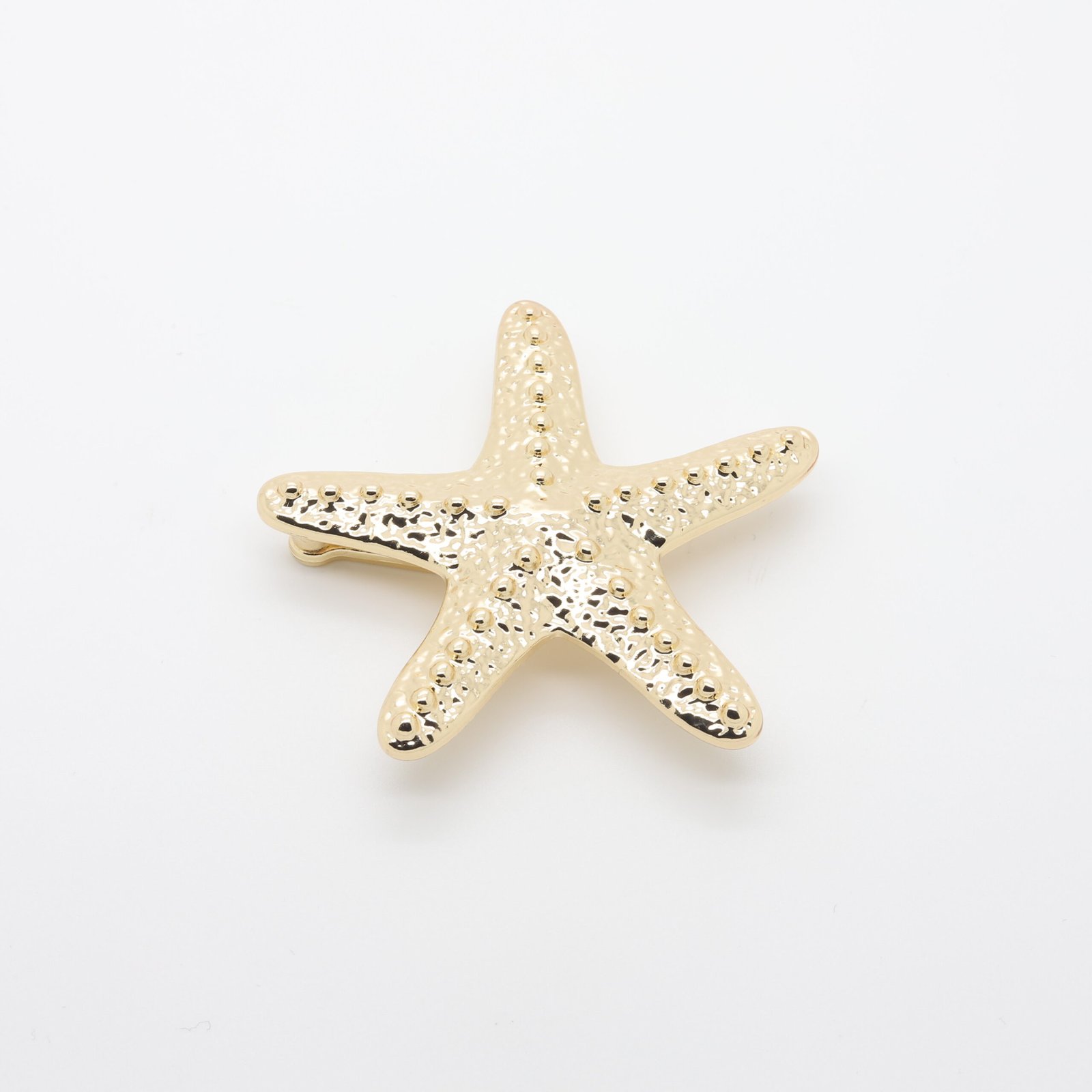 Passant en for d'étoile de mer en métal doré