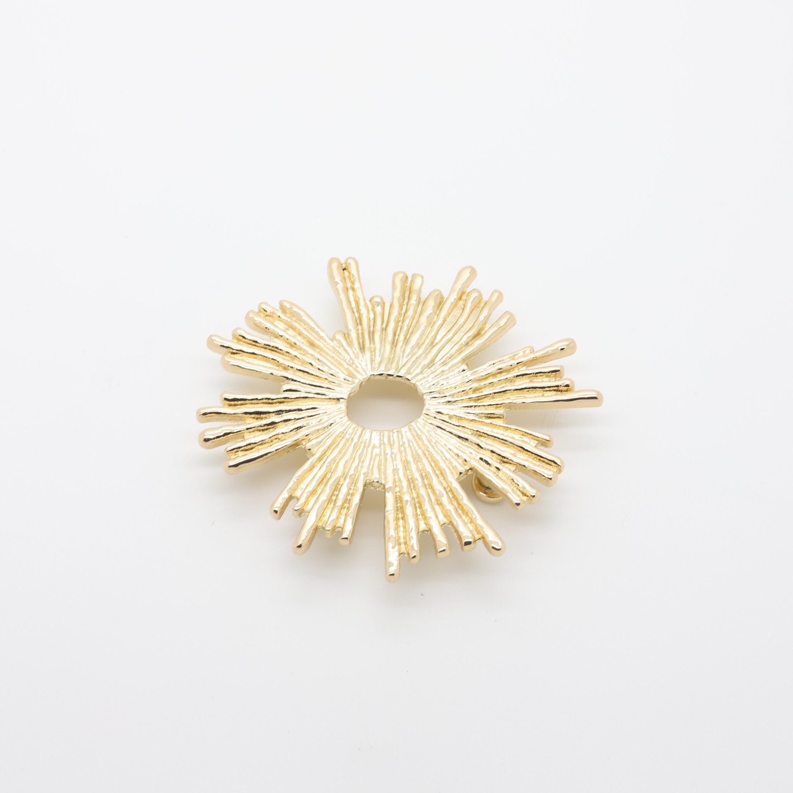 Passant décoratif en forme de soleil