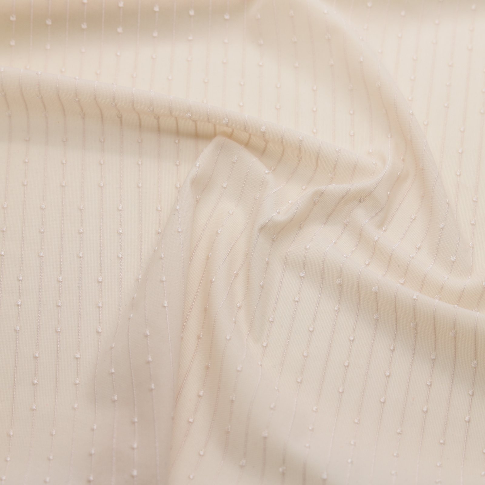 Tissu résille extensible à pois ivoire