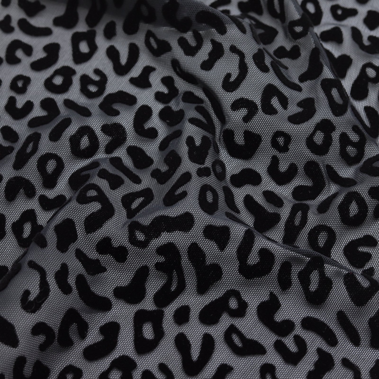 Résille extensible noire avec flocage léopard velours
